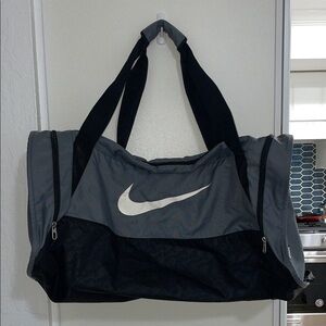 Nike Large Black and Gray Duffel Bag with White Swoosh Logo & Zip Side Pockets